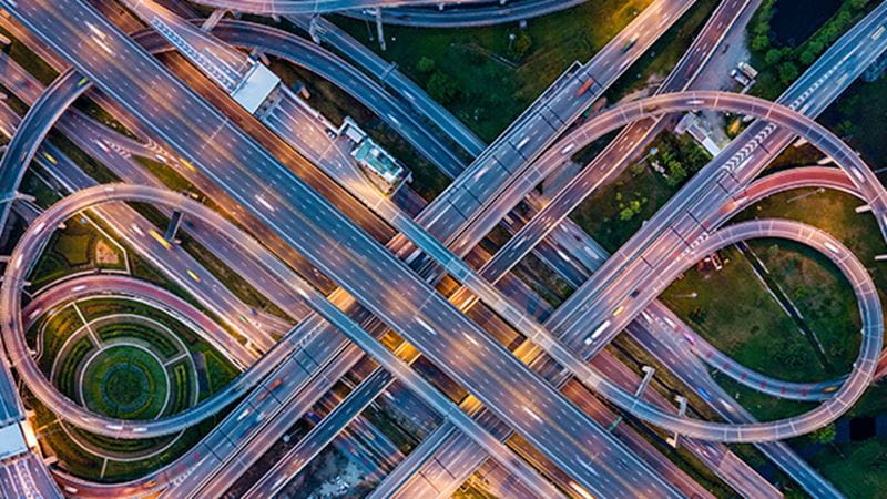 Arial timelapse photo of a highway intersection