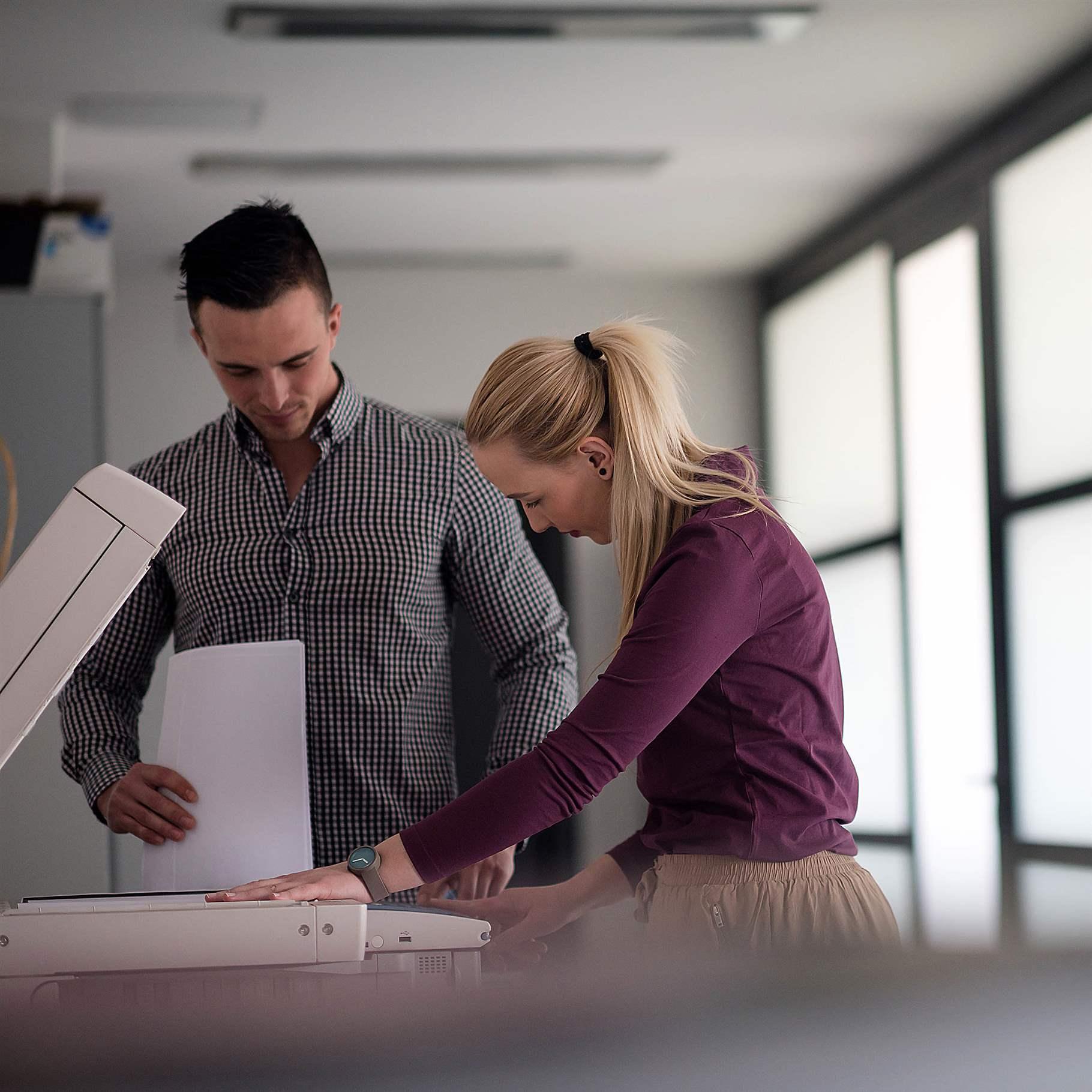 happy business people group at modern office copy  documents on machine