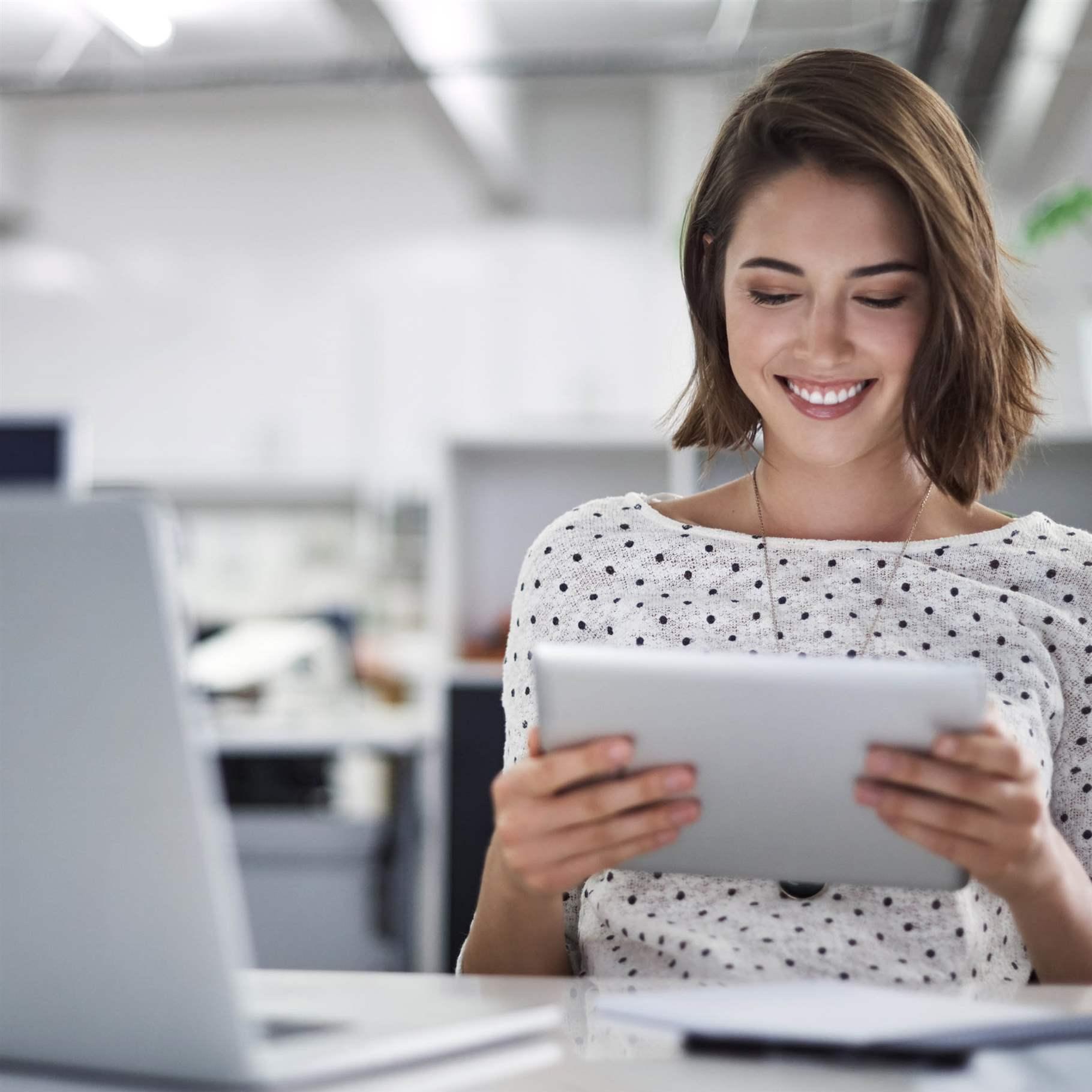 Shot of a businesswoman using her tablet at her desk
