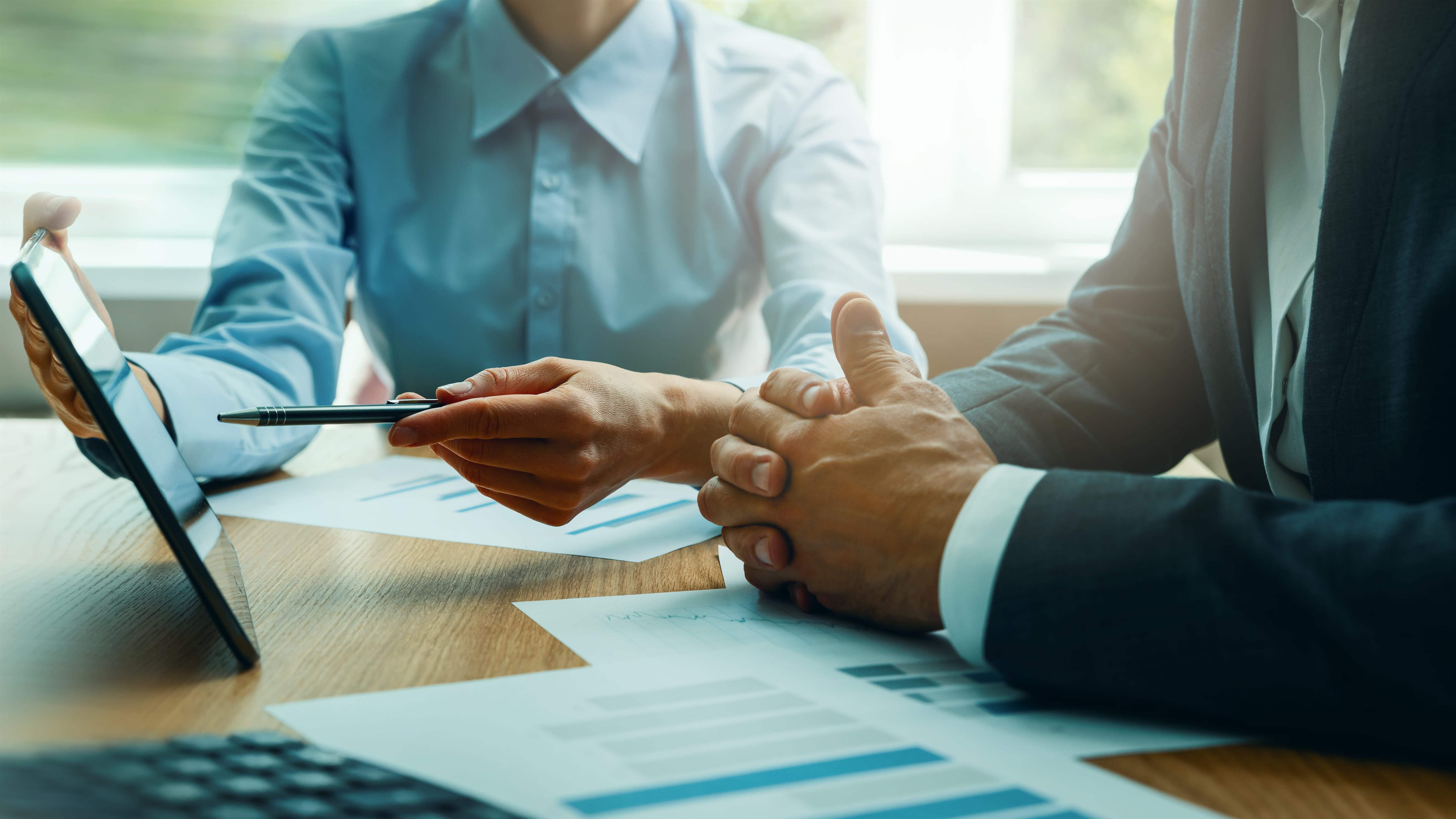 Advisor pointing to tablet