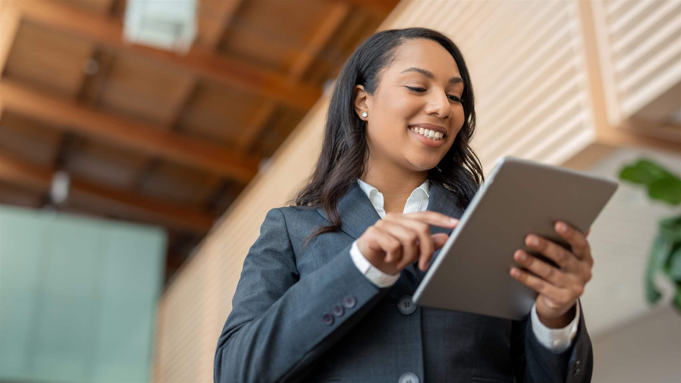 Woman on tablet in office