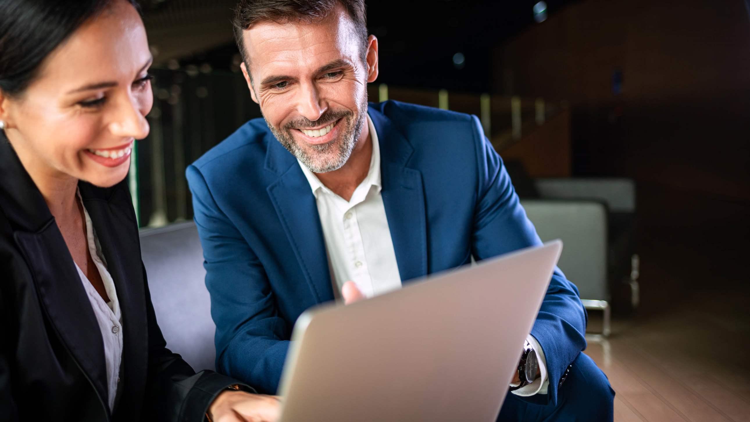 Businessman And Businesswoman Meeting In Modern Office