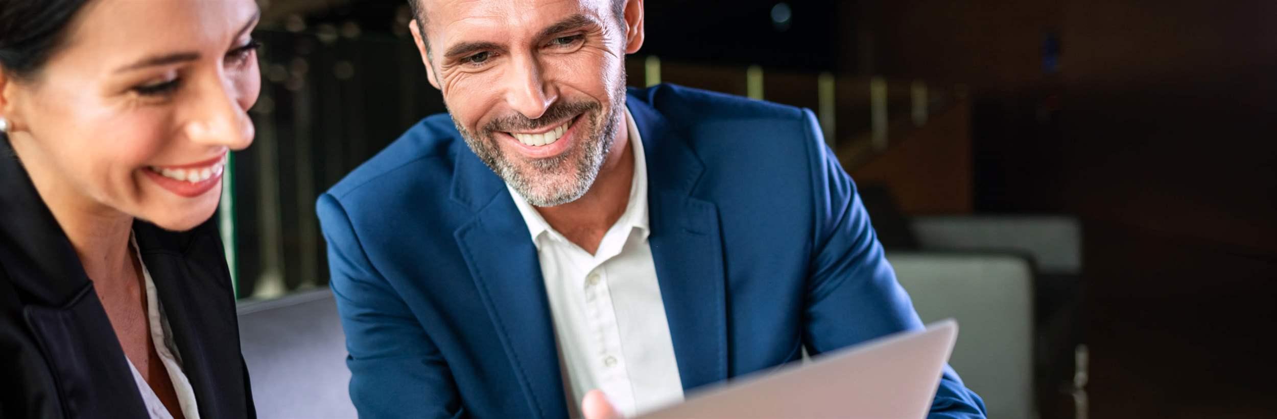 Businessman And Businesswoman Meeting In Modern Office