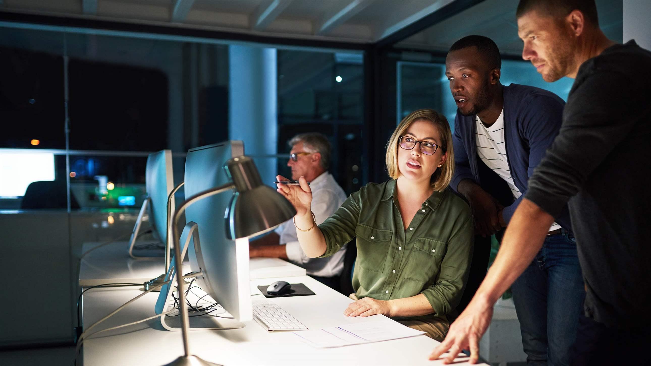 Shot of businesspeople working late in an office